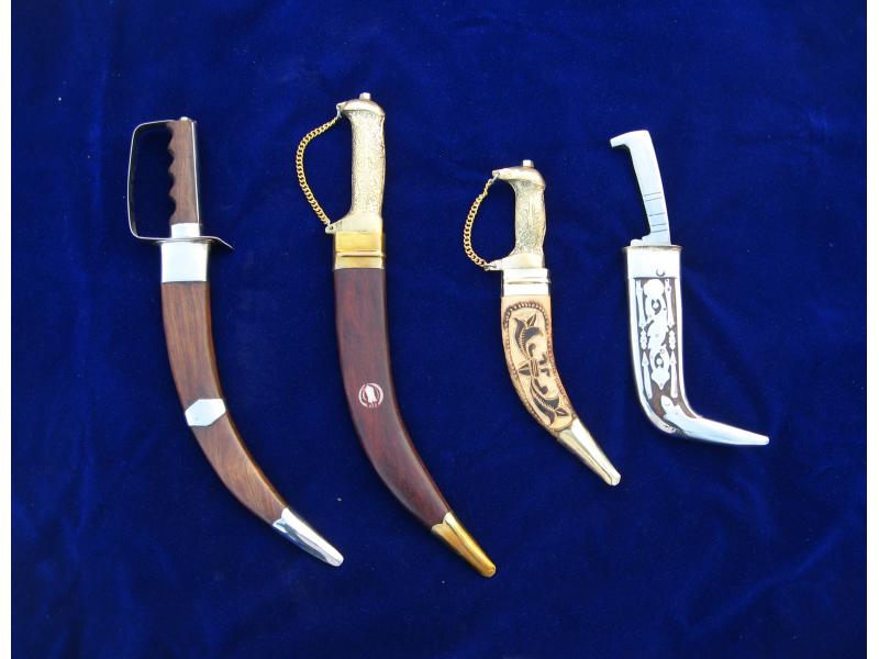 A picture of four different Sikh Kirpans. It shows that the ceremonial sword or dagger may be any size or shape.